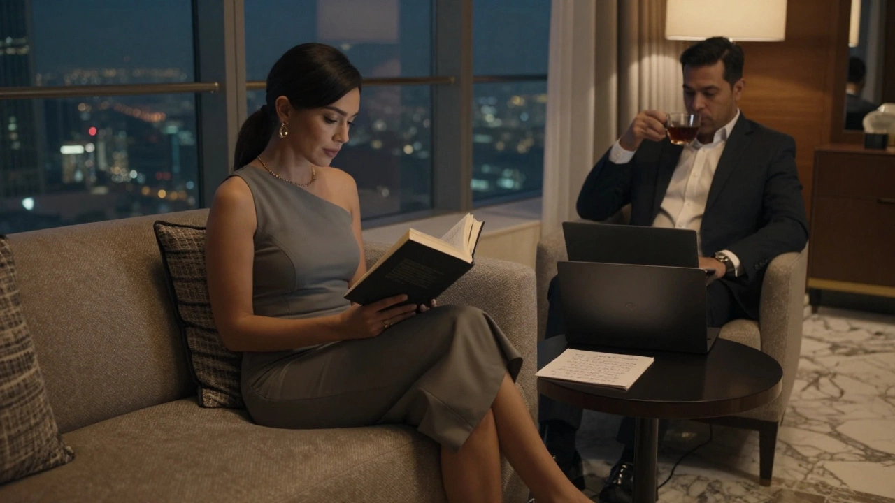 A sophisticated woman reading a book in a high-end hotel lounge while a man relaxes nearby in calm, intimate lighting.